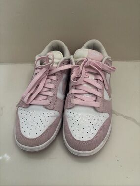These are Nike Dunk Low Pink Corduroy sneakers in white and pink foam